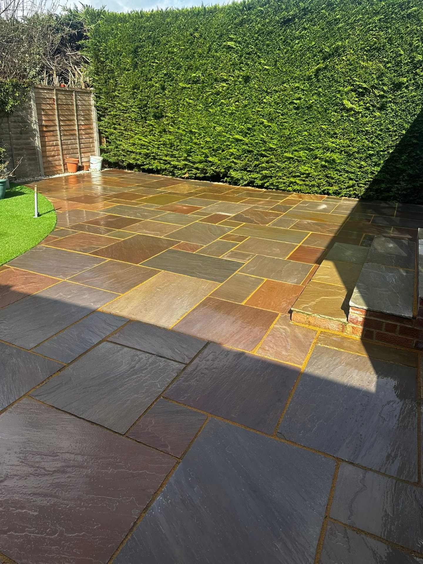 Indian sandstone patio after professional cleaning in Dorset